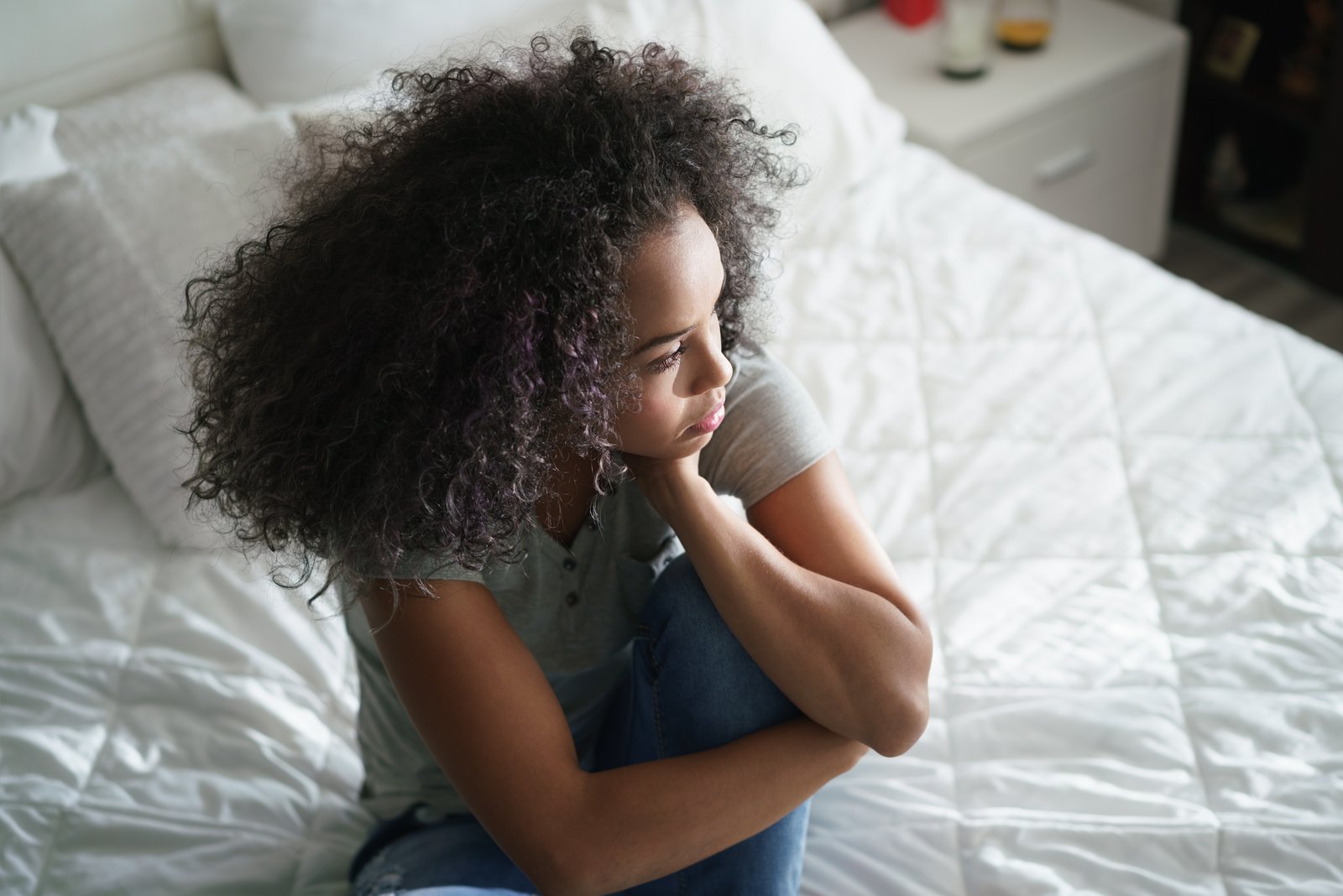 Woman alone in bed